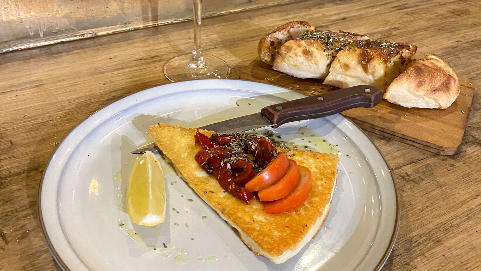 Saganaki and garlic bread by the window at Black Drop, Black Rock