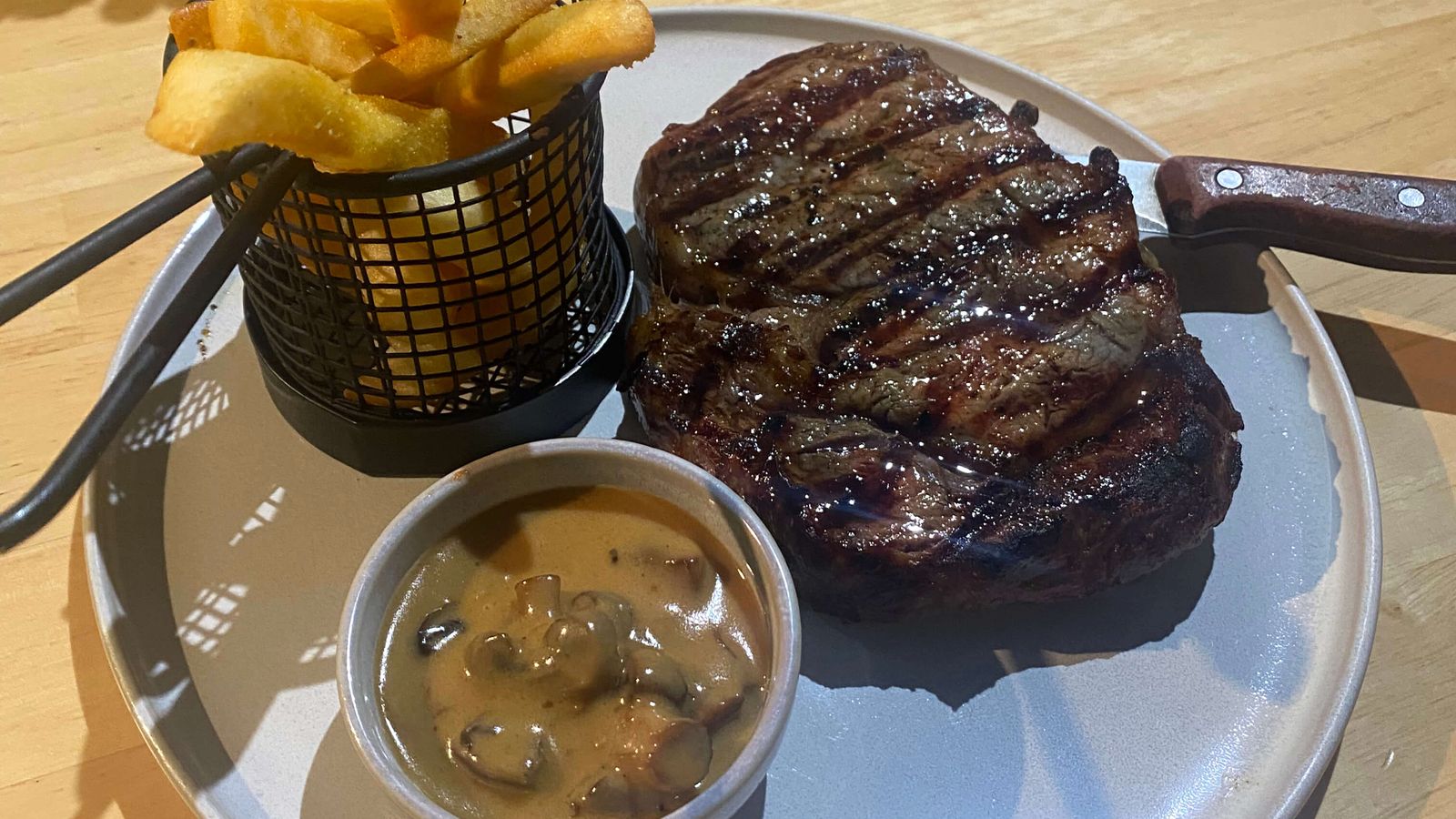 Char-grilled steak with chips and mushroom sauce at Black Drop, Black Rock