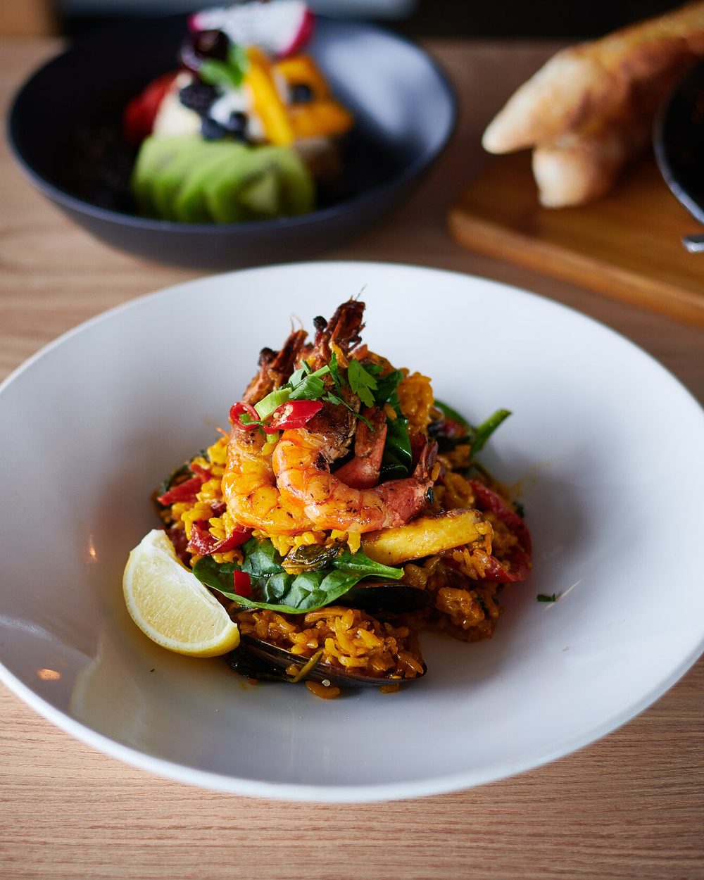Plated seafood paella with prawns and mussels at Black Drop, Black Rock