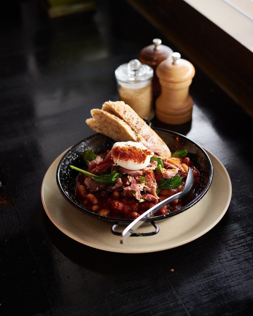 Slow-cooked pork hock with beans and poached egg at Black Drop, Black Rock