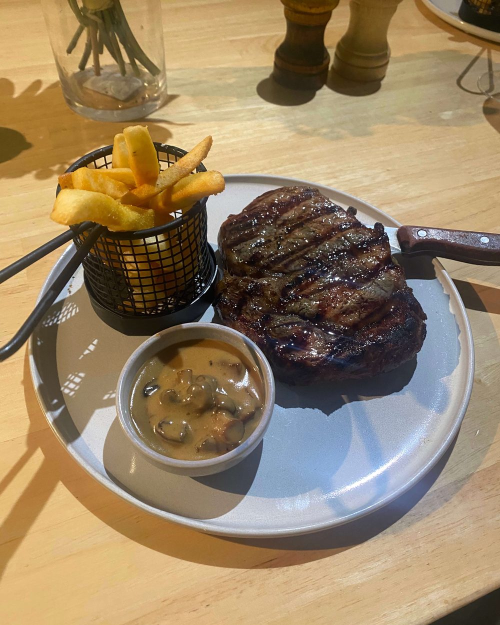 Char-grilled Black Angus steak with chips and mushroom sauce at Black Drop, Black Rock